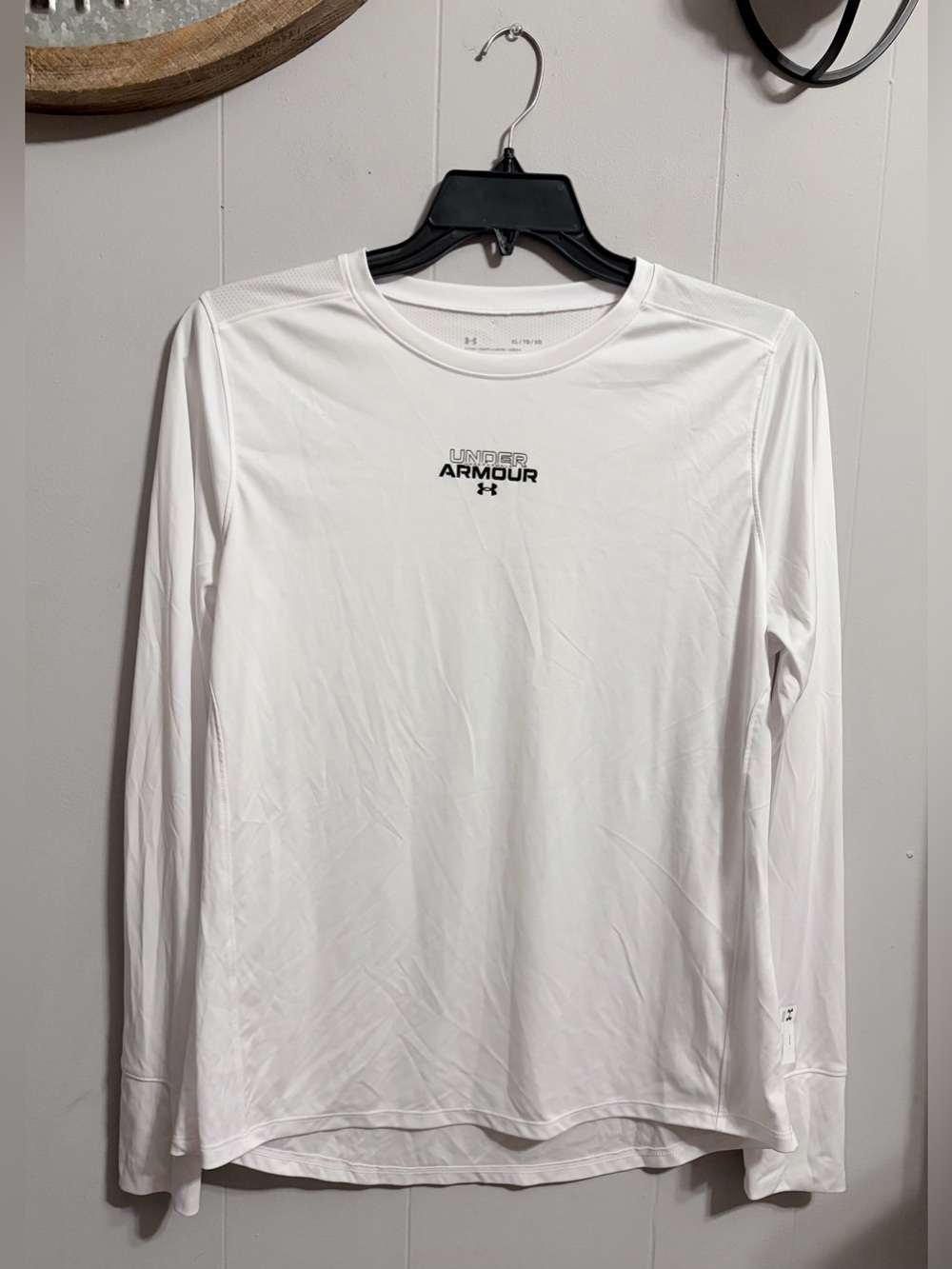 Under Armour White Long Sleeve Performance Shirt small pin whole where MFG tag
